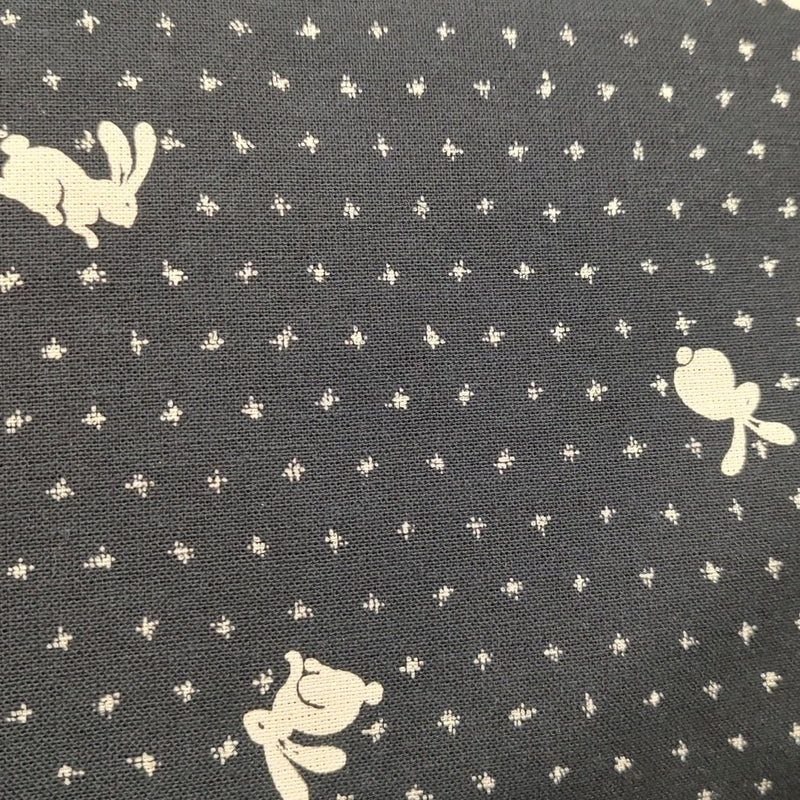 Mini Bunnies Playing on Black w small tan symbols in rows
